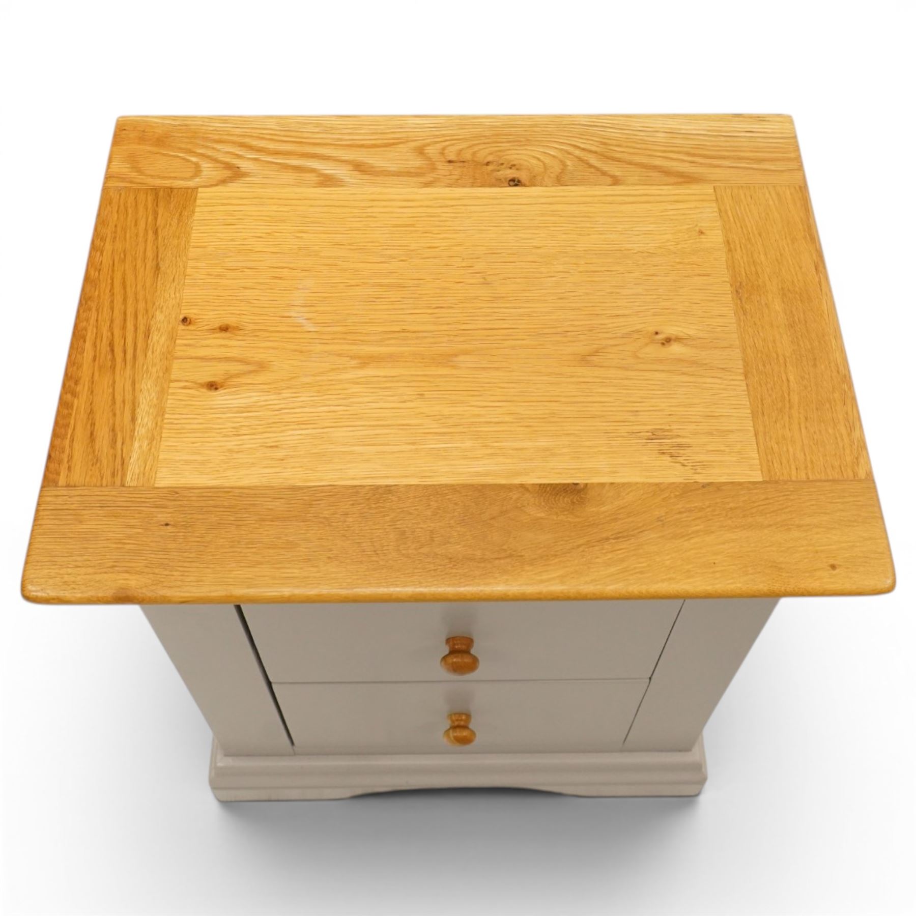 Modern bedroom suite comprising; a dresser, blanket box, bedside table, oak tops over a pale blue with wooden turned knobs

Dresser (H 77cm, D 48cm, W 107cm)
Blanket box (H 51cm, D 48cm W 91cm)
Bedside table (H 64cm, D 39cm, W 54cm)