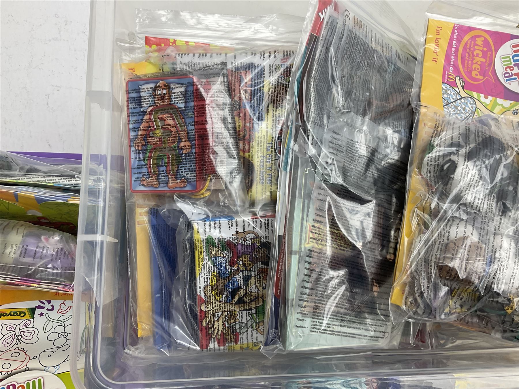 Large quantity of Mcdonalds toys to include Herbie and Polly Pocket in three boxes