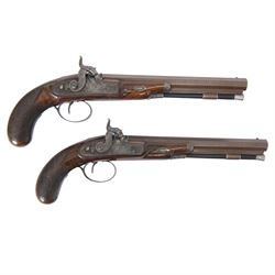 Pair of cased British officers' percussion cap dueling pistols by Braggs of London   (1932-1842), with 24cms octagonal Damascus steel sighted barrels with original browning, marked along the top Braggs 36 High Holborn London, ebony ramrods with steel caps and brass tips beneath, hammer, tang and trigger guard engraved with floral scrolls, figured walnut half stocks with chequered grips and vacant white metal cartouches, contained within a brass bound mahogany case with makers label to the lid, lined in green baize and containing bullet mould, powder flask, ram rod, percussion caps, case key and lead balls, pistol overall L40cm 