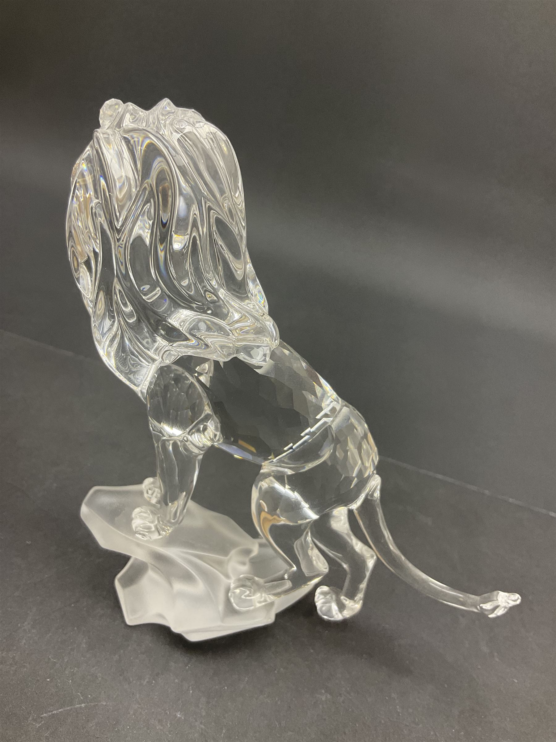 Swarovski Crystal animals, comprising camel and lion, both upon frosted crystal bases, together with Swarovski Crystal palm tree, upon similar frosted crystal base, tallest H14cm