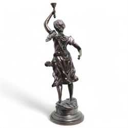 After Victor Rousseau (1865-1954)  - bronze sculpture of a lady holding aloft a torch and on circular base H50cm
