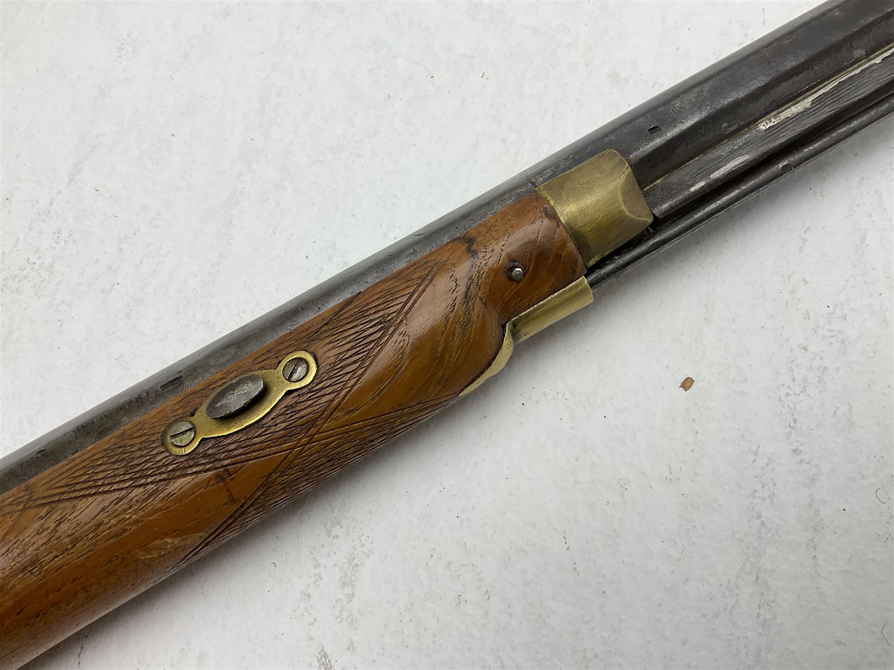 20th century Indian percussion musket, the 81cm octagonal barrel with under rib and ramrod, brass fittings including front and rear swivels, oak half stock with cheek piece and chequered pistol grip stamped 1589 L124.5cm overall