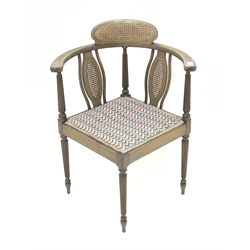 Edwardian mahogany corner chair, cane panelled back with reeded supports, upholstered seat, W59cm