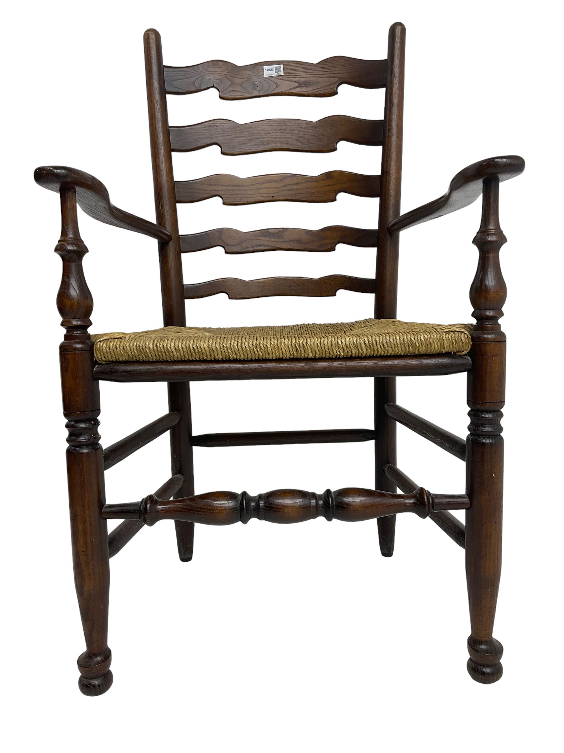 Set eight (6+2) oak dining chairs, high waived ladder back over rush seats, raised on ring turned supports with pad front feet, united by stretchers