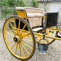 Victorian Two Wheeled Pleasure Driving Round Back Gig by Shanks of London

A Victorian two wheeled pleasure driving round back gig, painted in black and yellow, with upholstered forward facing seat for two, panelled dashboard, wooden spoked wheels, iron step and shafts for a single horse. The vehicle is fitted with a rear luggage compartment and mounted on elliptic springs.

Features
• Black and yellow painted body
• Upholstered forward facing seat
• Panelled dashboard
• Rear luggage compartment
• Wooden spoked wheels
• Iron step
• Elliptic spring suspension
• Shafts for a single horse

Dimensions:
Overall length: 310 cm
Width: 160 cm
Body width: 82 cm
Height: 160 cm

Wheel Diameters:
Wheels: 138 cm

Seating:
Driver and passenger: 2