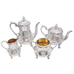 Victorian four piece silver tea service, comprising teapot, coffee pot, cream jug and twin handled open sucrier, each of hexagonal bellied form, the cream jug and sucrier with gilded interiors, engraved with foliate detail and monogrammed initials to central circular panel, with scroll handles and upon four scroll pad feet, the teapot and coffee handles with ivory insulators, the coffee pot, cream jug and sucrier hallmarked Henry Holland, London 1866, the teapot hallmarked Henry Holland, London 1856, approximate total weight 86.24 ozt (2682.6 grams) This item has been registered for sale under Section 10 of the APHA Ivory Act