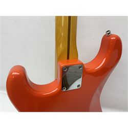 Japanese Squier Fender 'Hank Marvin' Stratocaster electric guitar, c1992, in Fiesta red with tremolo arm and facsimile signature decal; serial no.L037281, L98cm; in hard carrying case.