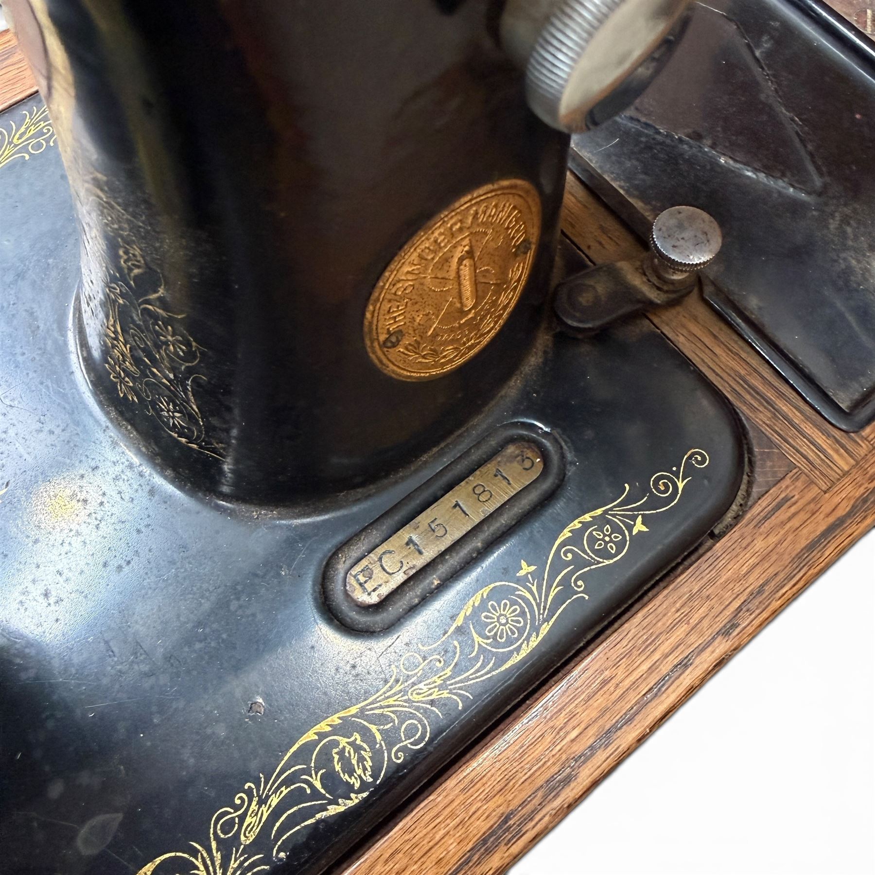 Three Singer wooden cased sewing machines 