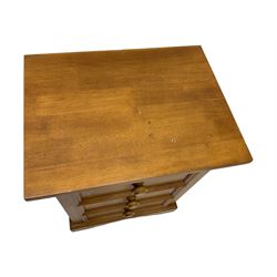 Pair of contemporary cherry wood bedside chests, rectangular top and projecting moulded cornice over three drawers, on plinth base with shaped apron