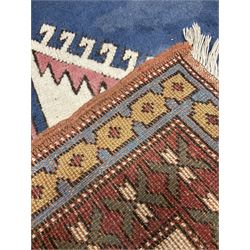 Turkish rug, blue ground field with large central medallion, four band border decorated with geometric motifs