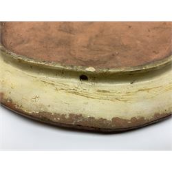 Pair of 19th century classical terracotta relief wall plaques depicting the goddess Hygeia and another goddess, seated holding an ewer, each of oval form, indistinctly signed, each stamped Ferreira verso, H42cm, W30cm