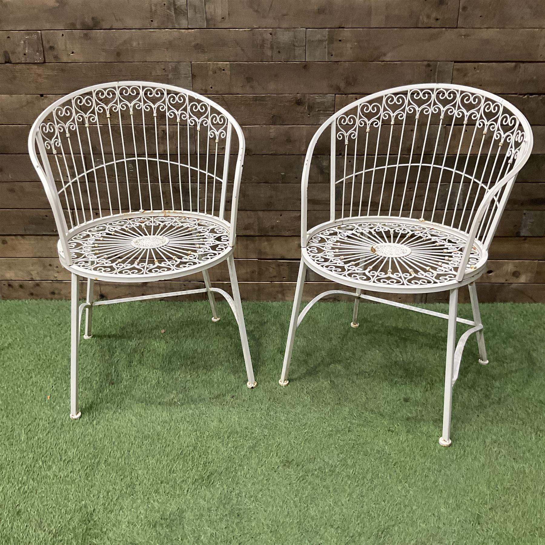 Pair of wrought metal white painted wirework garden chairs - THIS LOT IS TO BE COLLECTED BY APPOINTMENT FROM DUGGLEBY STORAGE, GREAT HILL, EASTFIELD, SCARBOROUGH, YO11 3TX