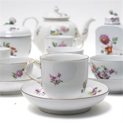 18th century Berlin part tea and coffee service circa 1780 painted with sprays of Spring flowers comprising four tea cups, five coffee cups,  six saucers, tea pot, tea caddy and sucrier and cover  