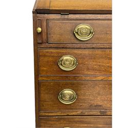 George III mahogany bureau, the fall-front banded and with boxwood stringing, enclosing fitted interior with pigeonholes and drawers surrounding a central cupboard with inlaid shell motif, the base with four graduating cock-beaded drawers, each with pressed brass handle plates with central lion masks and ivory escutcheons, on shaped bracket feet
This item has been registered for sale under Section 10 of the APHA Ivory Act