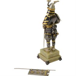 Italian limited edition silvered and gilt bronze figure of a Samurai warrior, with sword and flag, signed Giuseppe Vasari, no. 11/400,  upon an green stepped onyx base H25cm