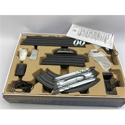 Carrera Go James Bond Die Another Day slot-car racing set No.60007; and MicroScalextric James Bond Aston Martin DB5 and DBS racing set, both boxed (2)