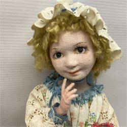 Anna Meszaros Hungary - three hand made needlewrok figurines - each wearing a lon floral dress and bonnet and holding a bouquet of flowers, tallest H32cm (3)  Auctioneer's Note: Anna Meszaros came to England from her native Hungary in 1959 to marry an English businessman she met while demonstrating her art at the 1958 Brussels Exhibition. Shortly before she left for England she was awarded the title of Folk Artist Master by the Hungarian Government. Anna was a gifted painter of mainly portraits and sculptress before starting to make her figurines which are completely hand made and unique, each with a character and expression of its own. The hands, feet and face are sculptured by layering the material and pulling the features into place with needle and thread. She died in Hull in 1998.