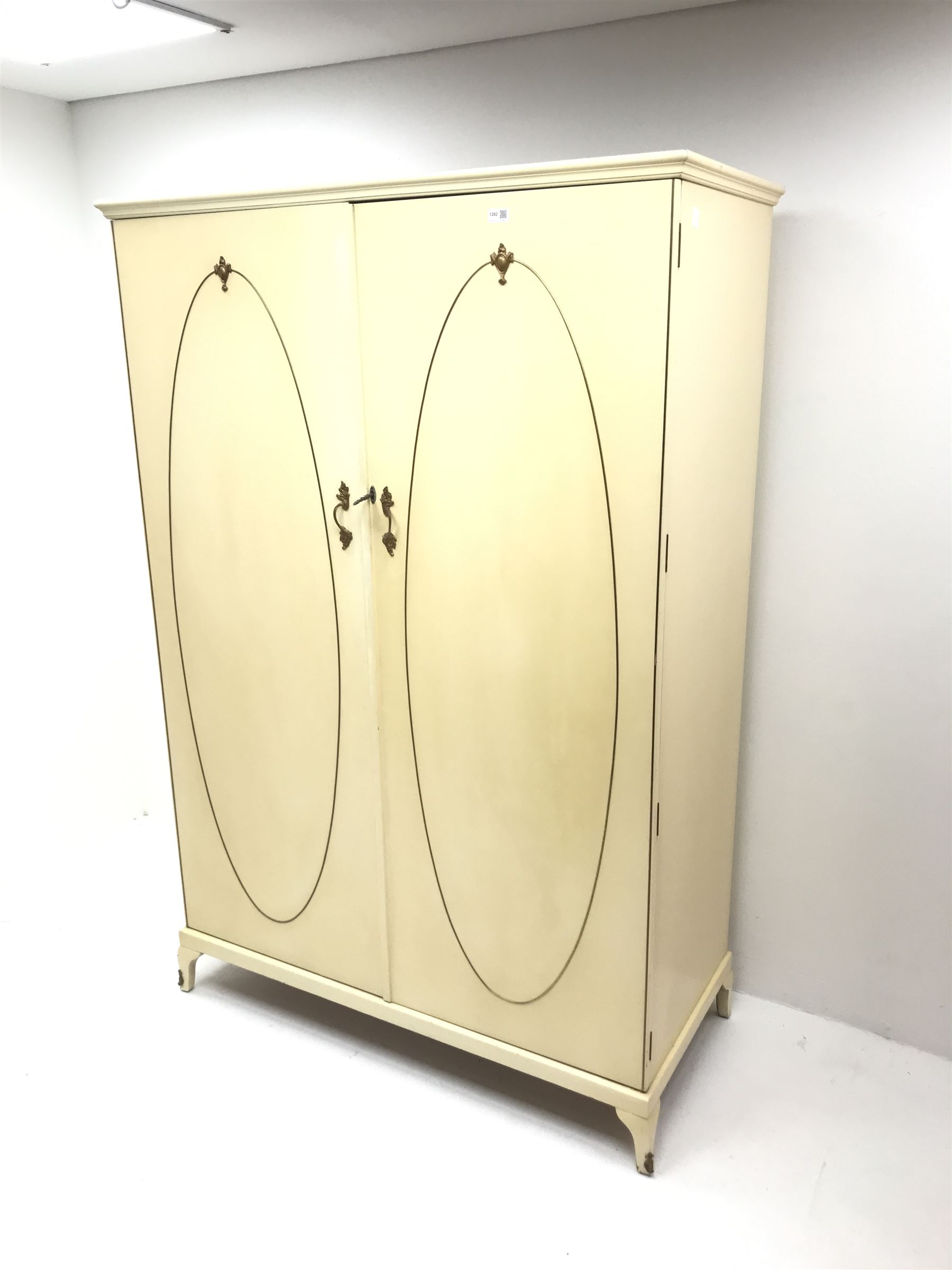 French style cream painted double wardrobe, two doors enclosing  single shelf and hanging rails, cabriole feet 