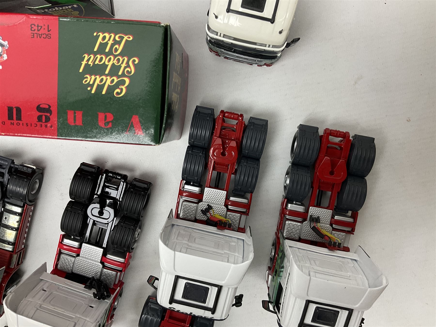 Eddie Stobart - three Oxford Die-Cast Super Rugby League lorries in perspex display cases including the two Hull Clubs; two Lledo Vanguard vans; two Days Gone vans; and Saico Truck & Trailer; all boxed; together with fourteen unboxed Corgi and other tractor/cab units etc (23)