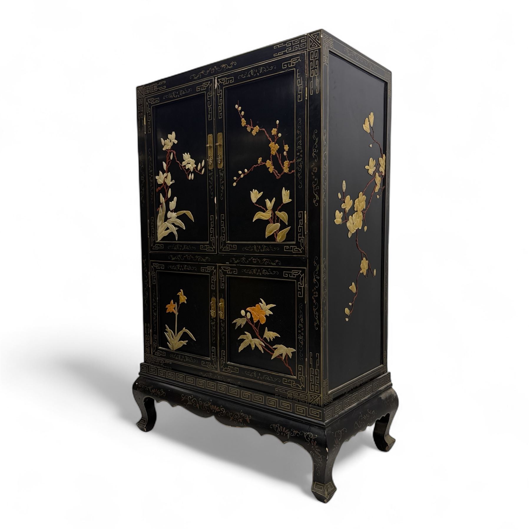 Late 20th century Chinoiserie black lacquer cabinet, the rectangular body decorated with hand-painted floral and foliate motifs in polychrome and gilt, fitted with four panel doors enclosing shelved interior, on shaped apron and stylised cabriole supports with gilt scrollwork