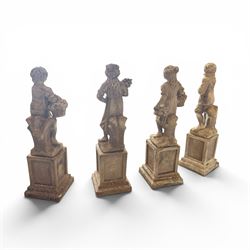 The Four Seasons - set of four traditional cast stone garden figures, in a weathered finish, stamped 'Lucas'