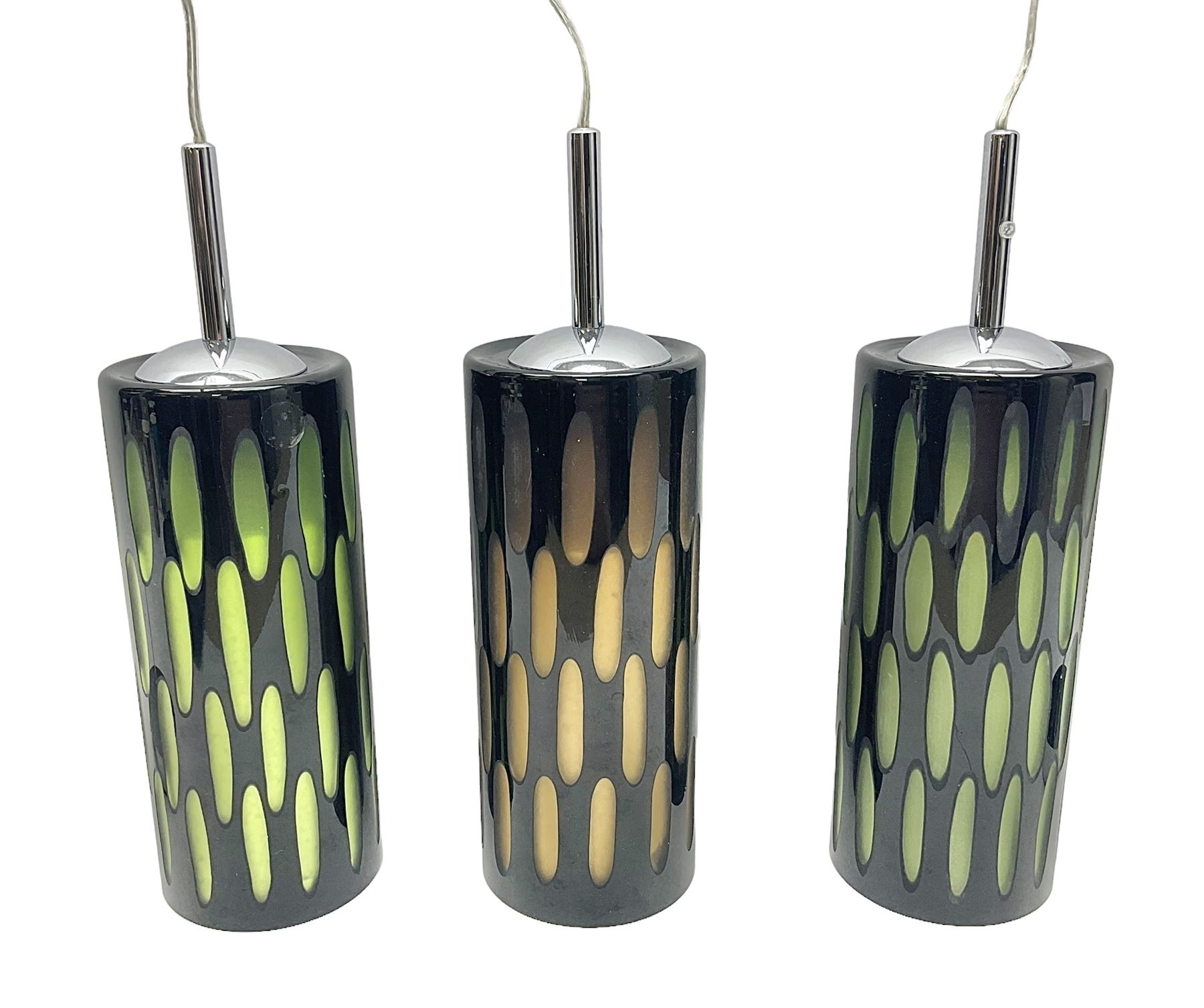 Three contemporary glass pendant lights, the black glass glass cut away revealing green and brown beneath, H24cm