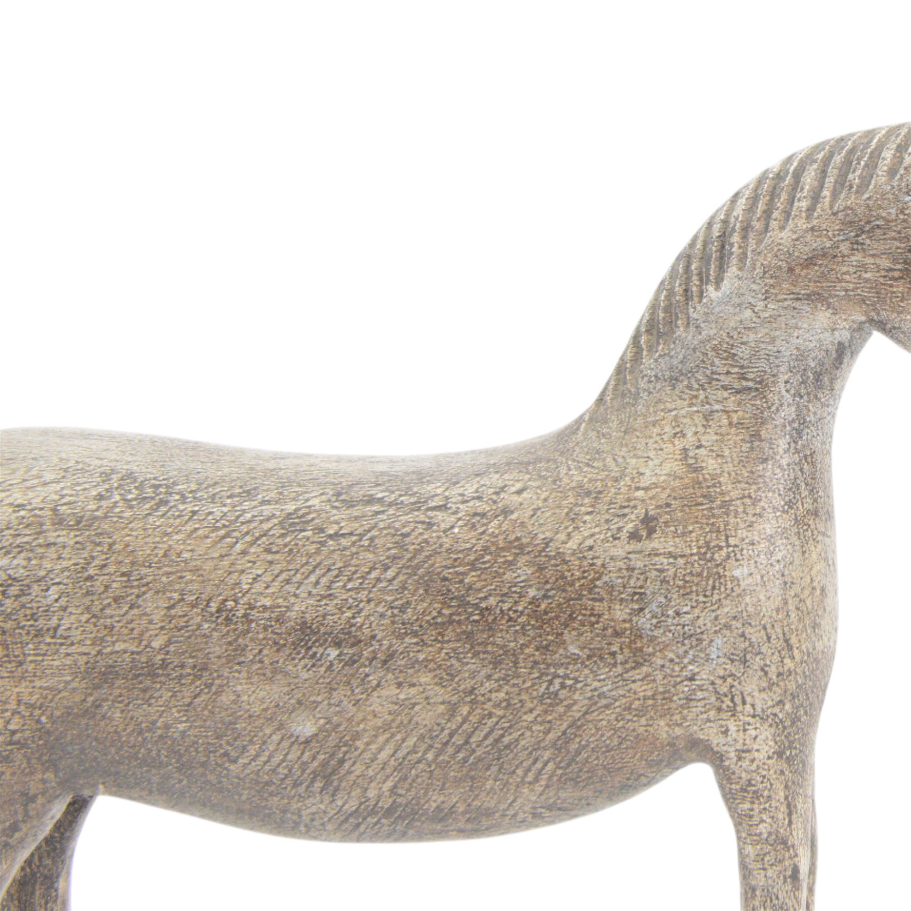 Carved Folk Art wooden horse, with glass eyes, H33cm