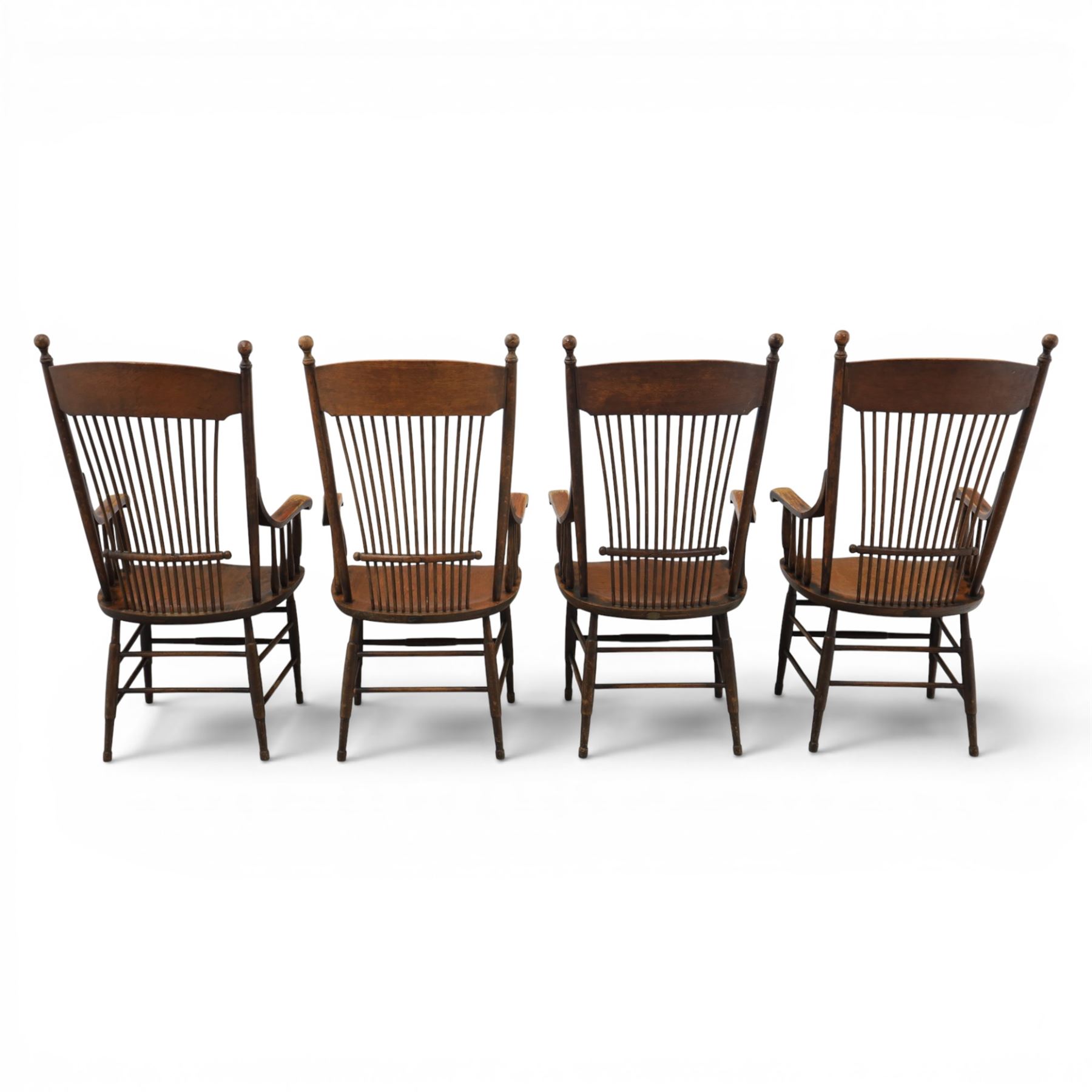 Set of eight 19th century ash and elm spindle back Windsor armchairs, arched top rails above fan-shaped spindle backs, curved arms with turned supports, shaped saddle seats, on turned legs joined by H-stretchers
