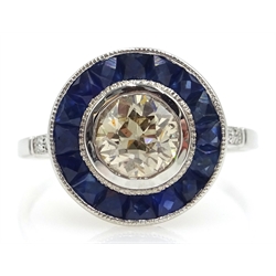  18ct white gold (tested) Art Deco style sapphire and diamond circular ring, central diamond 0.69 carat  