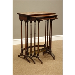  Two early Victorian amboyna wood nesting tables, on collar turned rosewood supports with splayed feet, brass floral and bead mounts, and a similar period rosewood table  