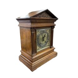 Winterhalder & Hofmeier - late 19th century Mahogany 8-day twin train mantle clock , with an architectural pediment  and carved tympanum, carved reeded pilaster to the front on a stepped plinth with  brickwork relief, square brass dial with cherub spandrels, matted dial centre and silvered chapter ring, dial pinned to a 