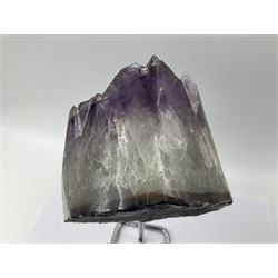 Amethyst crystal geode cluster, with large well-defined crystals, upon a metal stand, H21cm