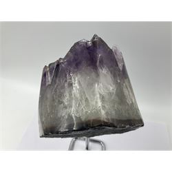 Amethyst crystal geode cluster, with large well-defined crystals, upon a metal stand, H21cm