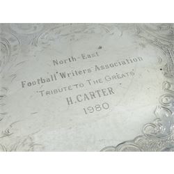 Raich Carter - Georgian style silver plated tray of circular form with pie-crust rim inscribed to the centre 'Derby County Former Players Association/Raich Carter/In recognition of/Services to Derby County/and to football' D32cm; and silver plated salver of circular form with cast fruiting vines to the rim and three bun feet, the chased centre inscribed 'North-East/ Football Writers Association/Tribute To The Greats/H. Carter/1980' D23.5cm. Provenance: By direct descent from the family of Raich Carter having been consigned by his daughter Jane Carter. (2)