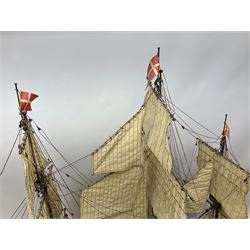 Wooden model of the three mast sailing ship with full rigging, on a wooden display base, H95cm, L110cm