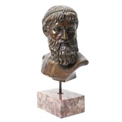 After the antique – a bronze bust modelled on the Artemision Bronze depicting the Greek god Zeus, the bearded head with intense gaze and idealised Classical features, raised on a marble plinth, H49cm Notes: the original is now held at the Archaeological Museum of Athens after being recovered from the sea off Cape Artemision