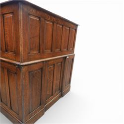 Globe Wernicke - Oak roll top desk, tambour roll top enclosing a fitted interior, raised on two pedestal bases with fitted drawers, raised on a plinth base 