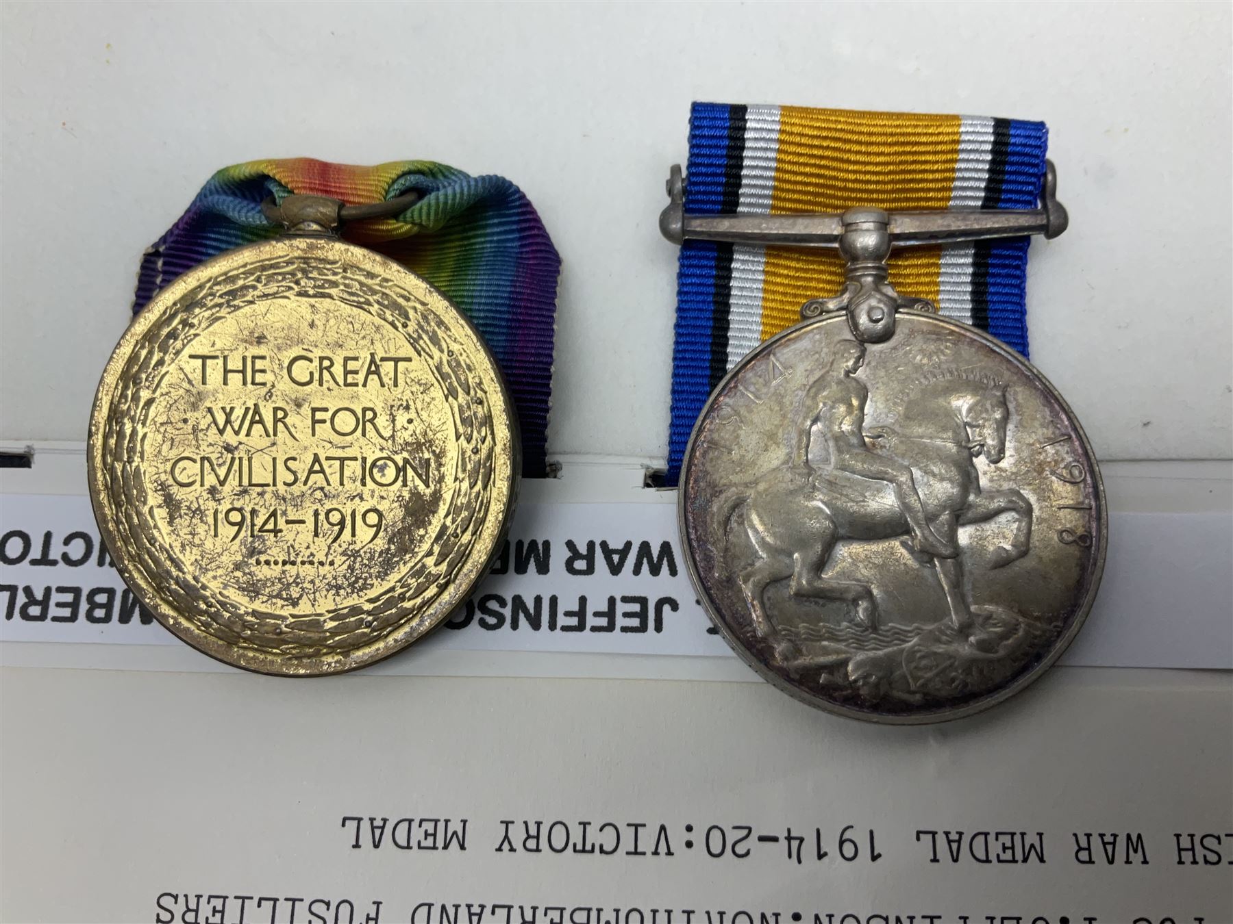 WWI pair of medals comprising British War Medal and Victory Medal awarded to 39357 Pte. T. Jeffinson Northumberland Fusiliers; both with ribbons (2)