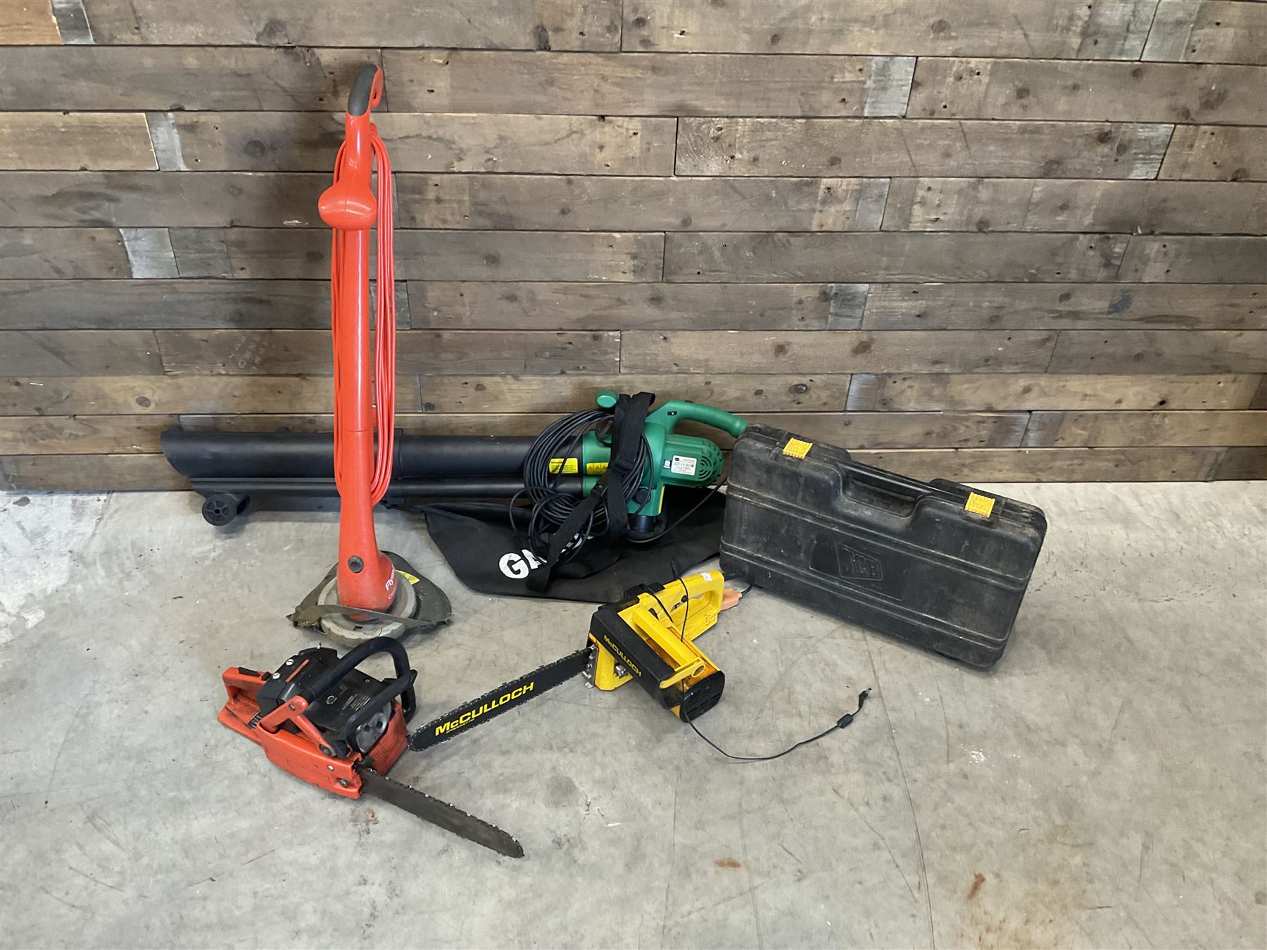 Workx electric lawnmower with two batteries, charger and dock, Garden Gear telescopic chainsaw, McCulloch chainsaw, another chainsaw, Flymo strimmer, GardenLine vac and a JCB drill