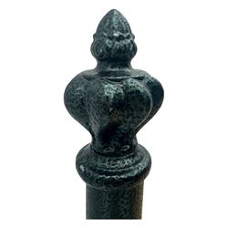 Contemporary metal double bed frame, shaped head and footboards with foliate cast panels and vertical rod supports, the corner posts with urn-shaped finials, finished in a mottled verdigris-style green, with pine slatted base