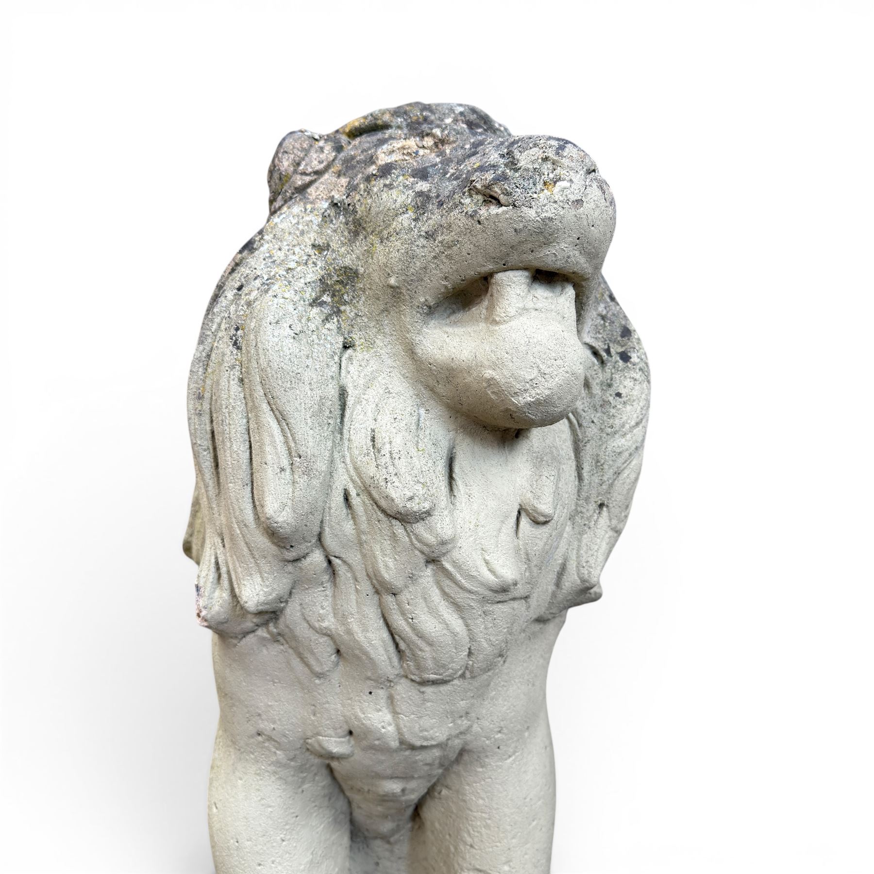 Pair of cast stone garden lions, seated on rectangular plinths