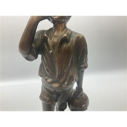 Spelter figure of a boy shouting on a stone base, H36cm. 
