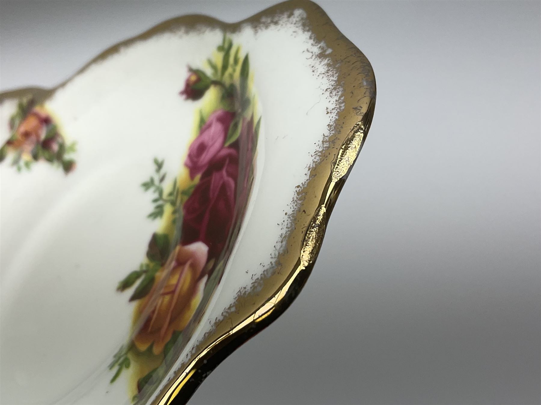 Royal Albert Old Country Roses pattern tea set, comprising teapot, coffee pot, six teacups and six saucers, five side plates, further teacup with joined saucer and side plate, open sucrier, milk jug, cake plate, and preserve pot and cover, together with Royal Albert Jubilee Rose pattern sauce boat and stand, and Royal Albert Lavender Rose pattern cake stand. 