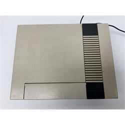 Nintendo Entertainment System (1985) console with two controllers, accessories and instruction booklet. NES Games ‘Duck Hunt’ with Nintendo Zapper gun, ‘Pinball’ and ‘Super Mario Bros.’, all with original sleeves and instruction booklets. NES game ‘Super Mario Bros. 2’ cartridge only