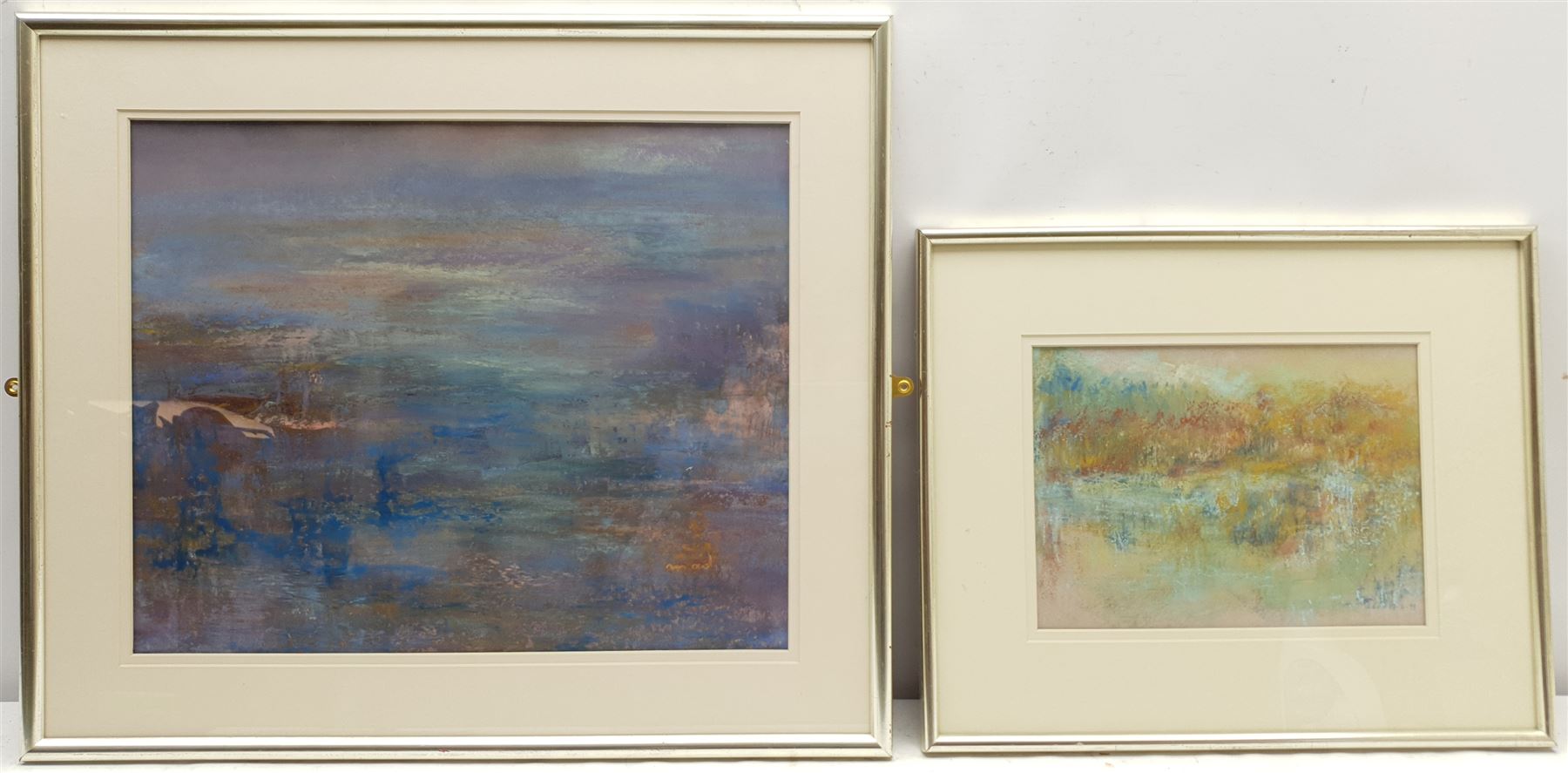 Madeleine Eyland (Belgian/British 1930-2021): 'Sleeping Waters' and 'Autumn', two pastels signed, one dated '99, titled verso 34cm x 42cm and 19cm x 26cm (2) 
Provenance: artist's studio collection. Marie-Madeleine Eyland (neé Legrain) was born in 1930 at Floriffoux, Belgium; she lived most of her life in Scarborough working as a nurse and an artist.