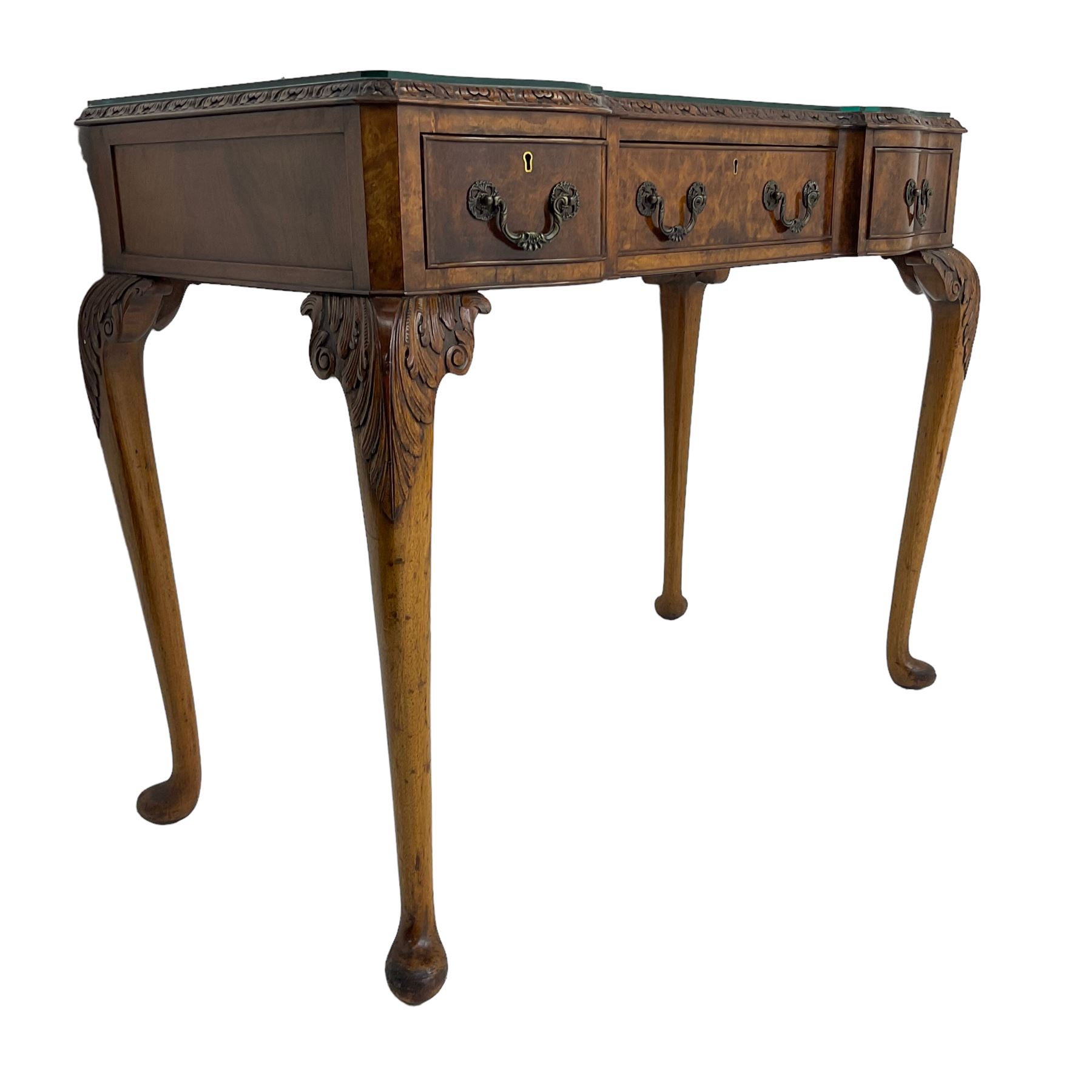 Early 20th century Queen Anne design walnut reverse break-front console side table, edge carved with acanthus decoration, fitted with three cock-beaded drawers, raised on cabriole supports with applied carved scrolling foliate decoration