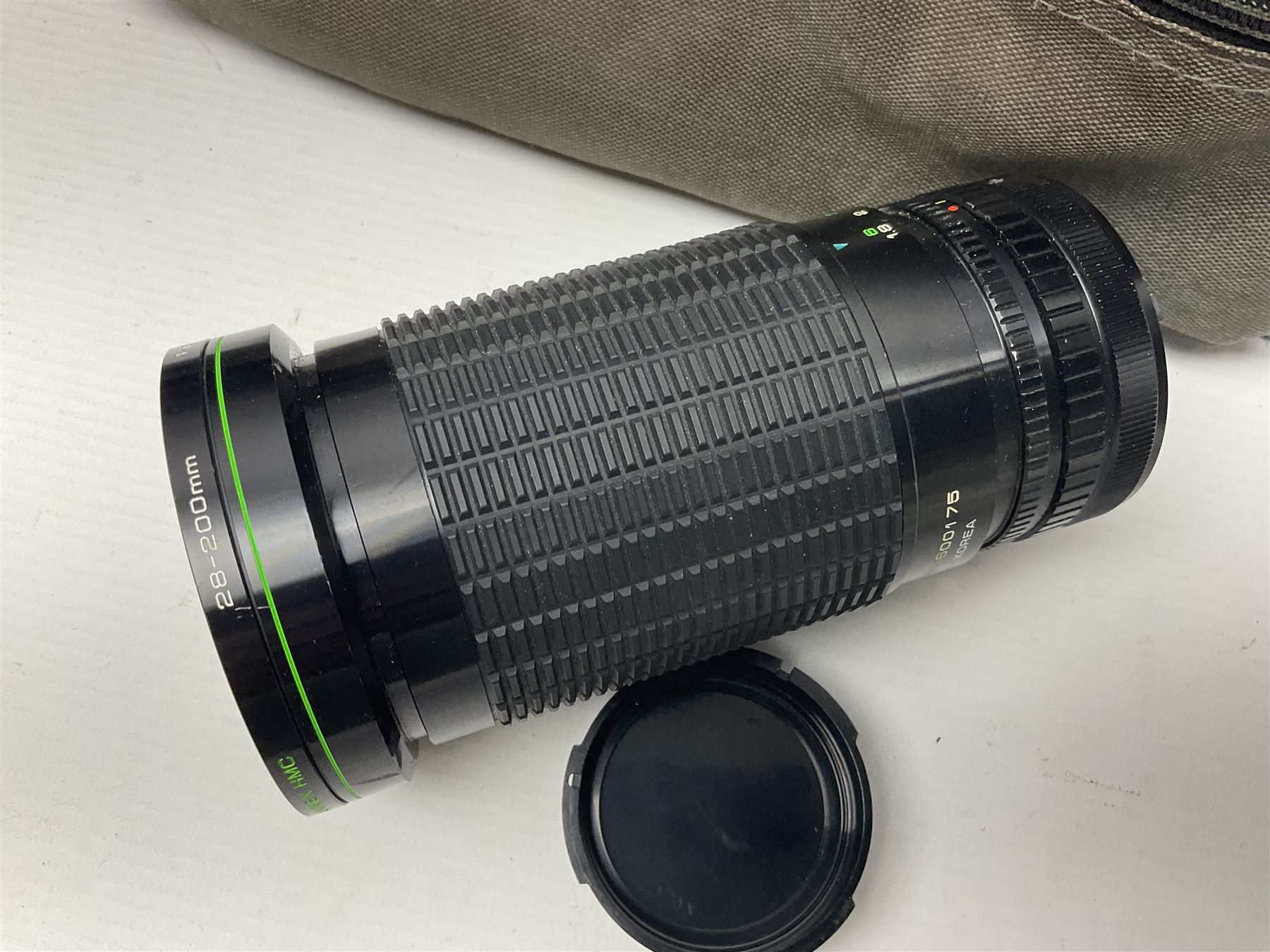Canon A1 camera body, serial no 775843, together with 'Canon Lens FD 200mm 1:4 lens' serial no 24432, together with Semi Minolta folding camera, Canon 'Zoom FD 35-105mm 1:3.5-4.5' lens, Canon 'Macro Focusing Zoom 72mm Hanimex HMC 28-200mm' lens and other camera equipment  