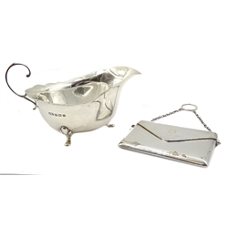  Silver envelope purse by Robert Pringle & Sons, Chester 1912 and silver sauce boat by William Suckling Ltd, Birmingham 1930  