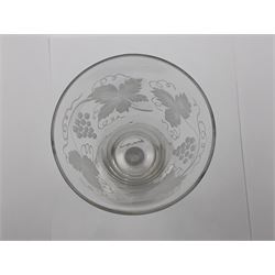 Set of three 18th century style wine glasses, each with funnel bowl etched with fruit vine, upon a double series air twist stem and circular foot, H17cm