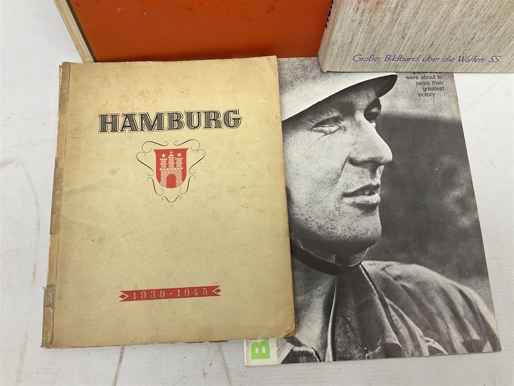 Adolf Hitler, Bilder aus dem Leben des Fuhrers [Pictures from the Life of the Fuhrer], Herausgegeben vom Cigaretten / Bilderdienst, Hamburg / Bahrenfeld, 1936, an album of two hundred tipped-in cards bearing photographs by Heinrich Hoffman, originally collected with cigarettes, 31 cm x 24 cm; together with a Waffen-SS book 'Wenn alle Bruder schweigen'; Hamburg 1939-1945; and two other booklets